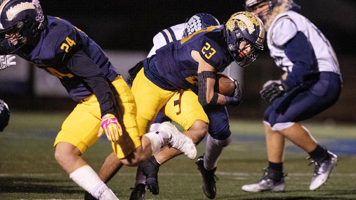 Meridian running back Marco Del Rio picks his way through the Middleton defense in the fourth quarter Friday. No. 1-ranked Meridian edged Middleton 18-6 in the 5A state quarterfinals.