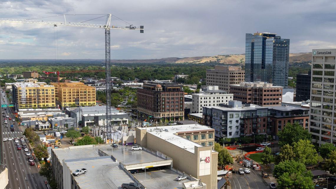 Downtown Boise has witnessed a recent boom in hotel development, many of them west of the historic downtown area. A crane can be seen at center left building the incoming dual-brand Marriott hotel with the now-complete Hotel Renegade in center. The roof of the Sparrow Hotel can be seen slightly below at right.