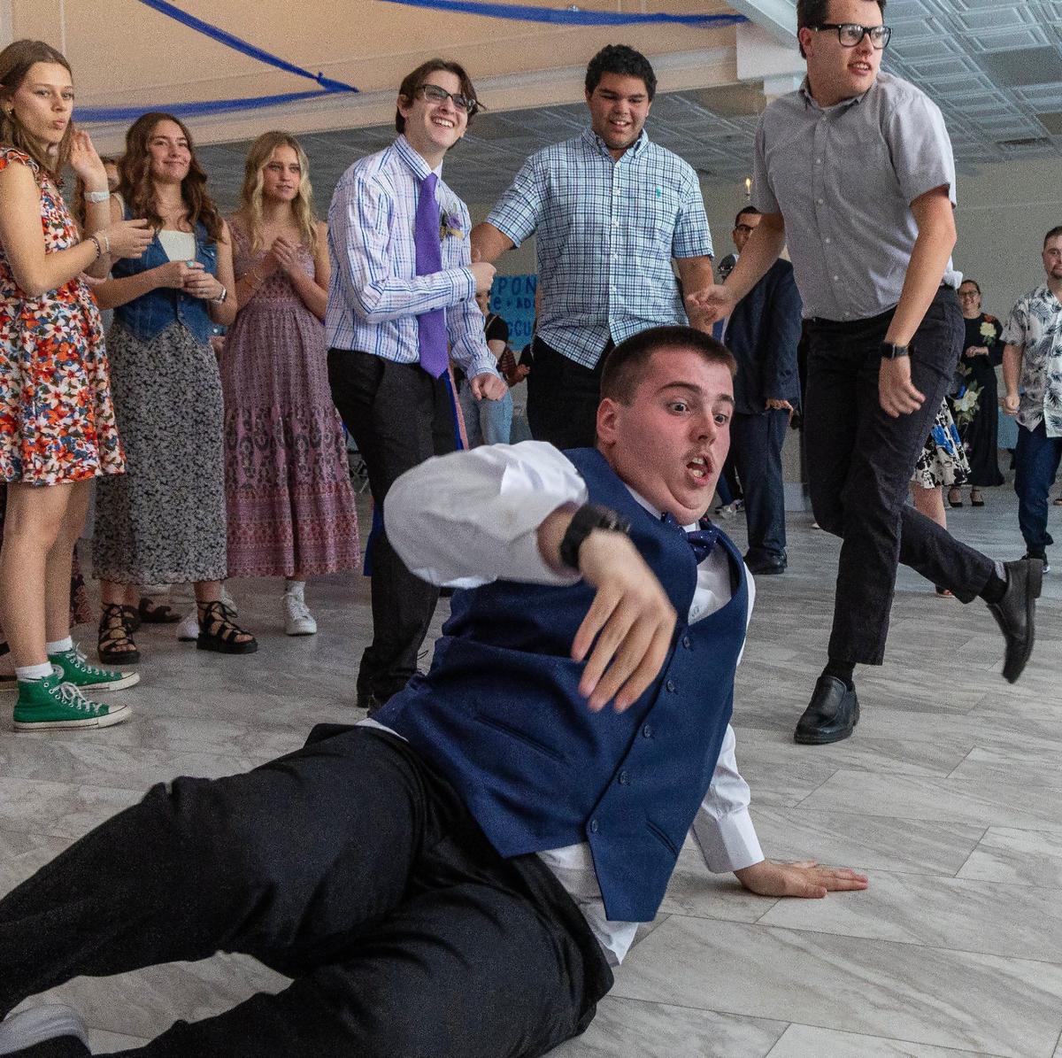 Hayden Tillery spins on the floor dancing during VIP Prom.