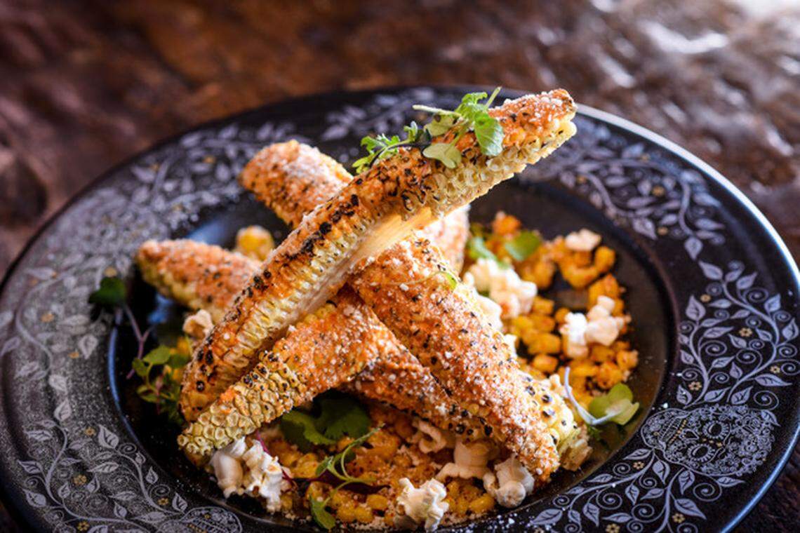 Esquites ($12): Fire-roasted corn, lime, Tajin, cotija cheese, spicy mayo and popcorn.