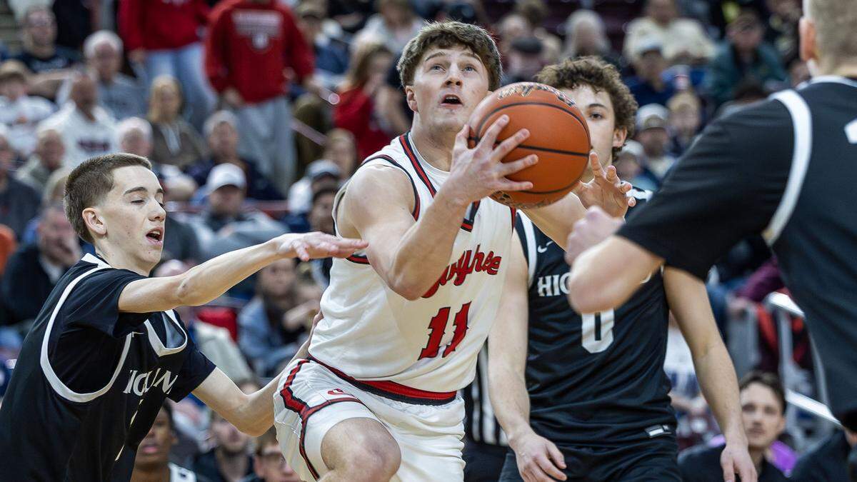 Owyhee guard Logan Haustveit drives through Highland's defense for a score. Haustveit finished with 15 points for the Storm, defeating Highland 66-45 in the 6A state boys basketball semifinals at Ford Idaho Center in Nampa, Friday, March 6, 2026.