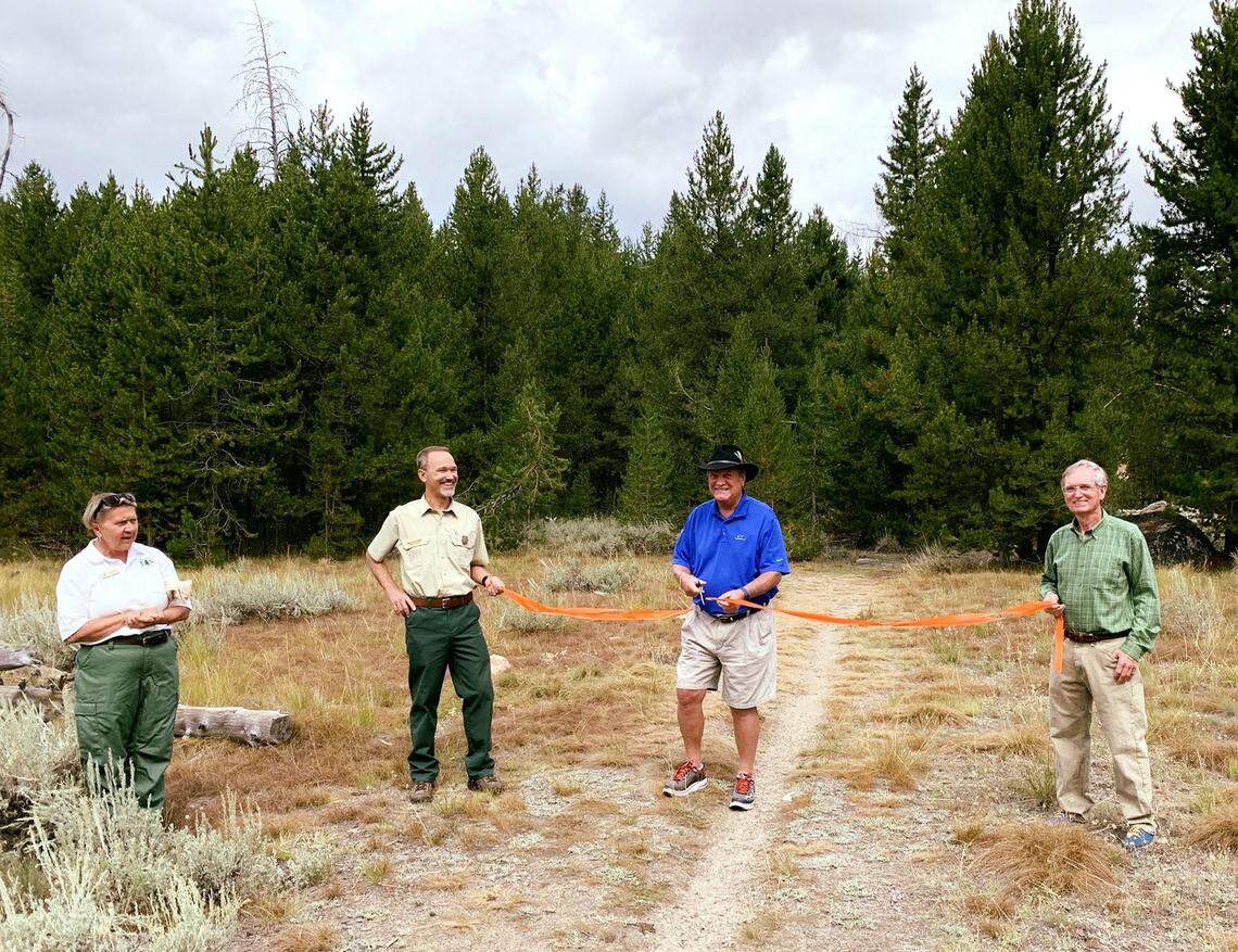 Idaho Congressman Mike Simpson, third from left, is joined by, left to right, Julie Thomas, U.S. Forest Service; Kirk Flannigan, U.S. Forest Service; and Steve Botti, mayor of Stanley on Monday, Aug. 12, 2019, for a ribbon-cutting marking the beginning of construction of a 4.5-mile trail connecting Stanley and Redfish Lake in central Idaho.