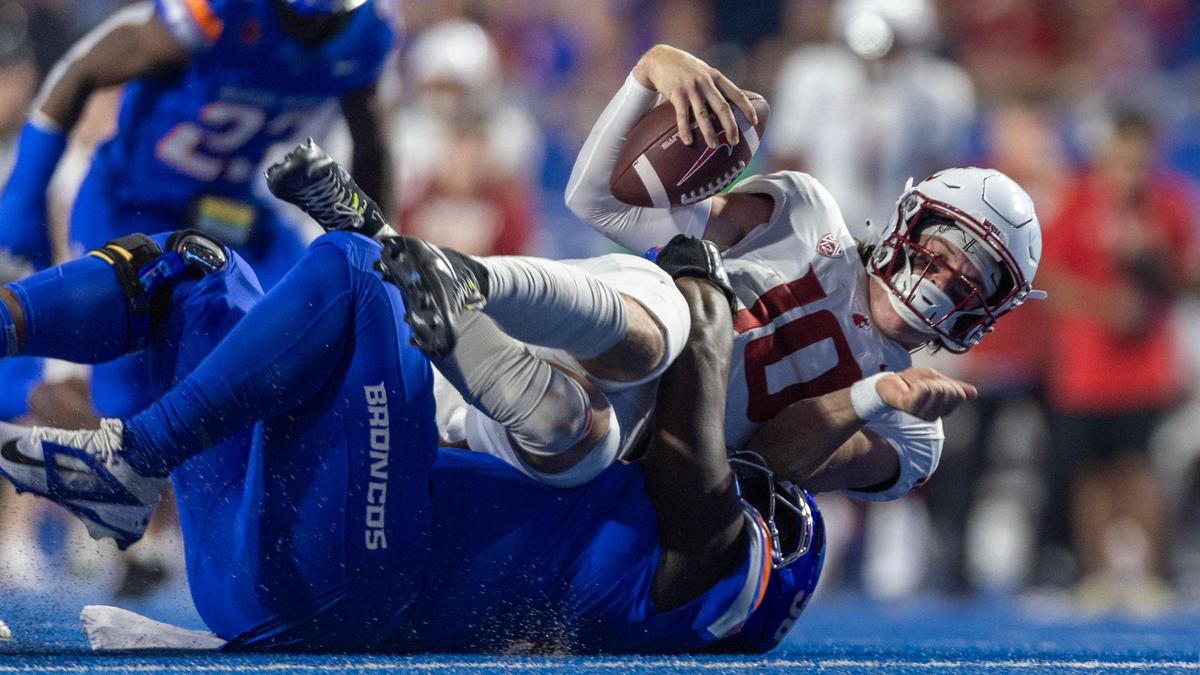 Boise State defensive tackle Braxton Fely sacks Washington State quarterback John Mateer on Saturday at Albertsons Stadium.
