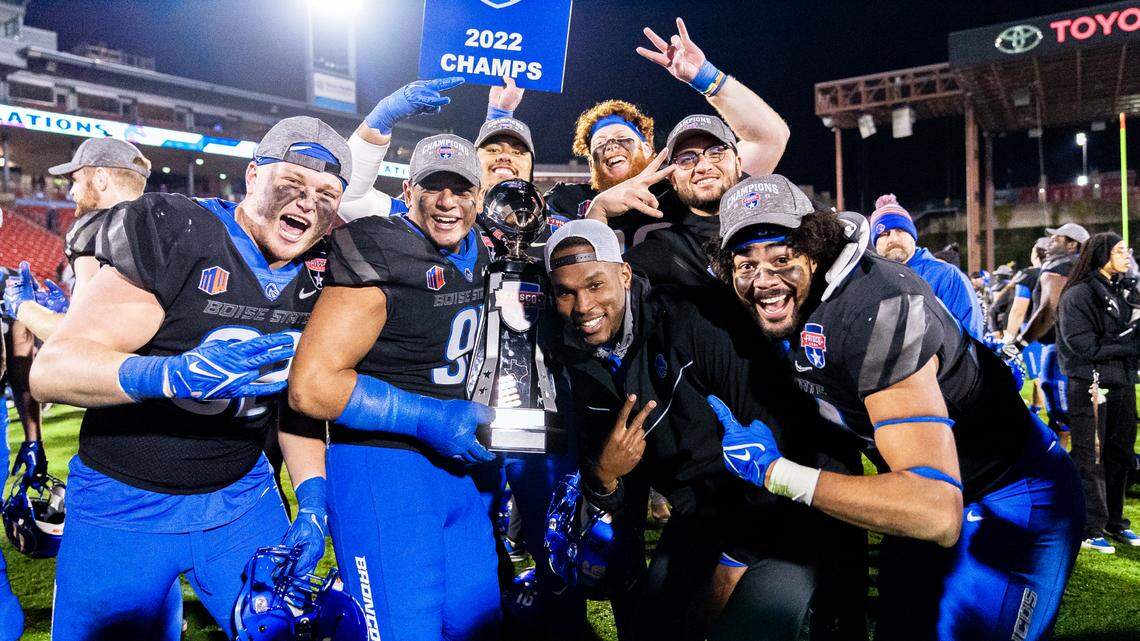 Boise State edge coach Jabril Frazier celebrates with a group of defensive linemen after the Broncos’ 35-32 win over North Texas in the Frisco Bowl. Frazier, who played at Boise State from 2015 to 2018, spent three years as a graduate assistant before he was hired as a full-time position coach last December.