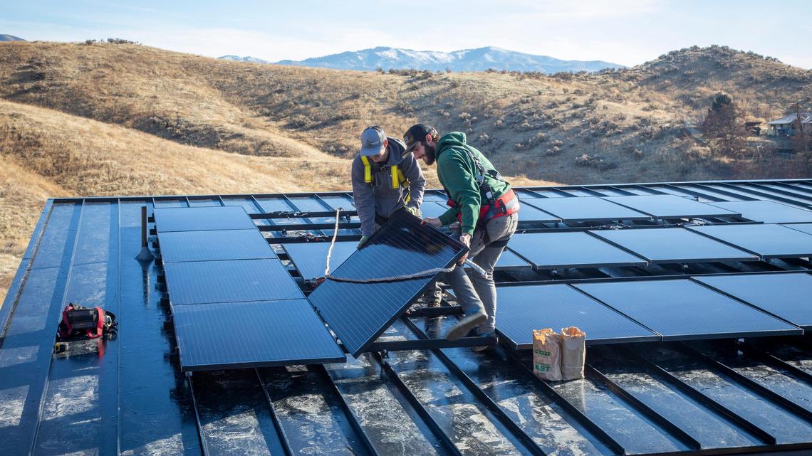In this Idaho Statesman file photo from 2019, two workers install solar electric panels on a home under construction in the Boise Foothills. Idaho Power encourages customers to know the facts when considering solar power.