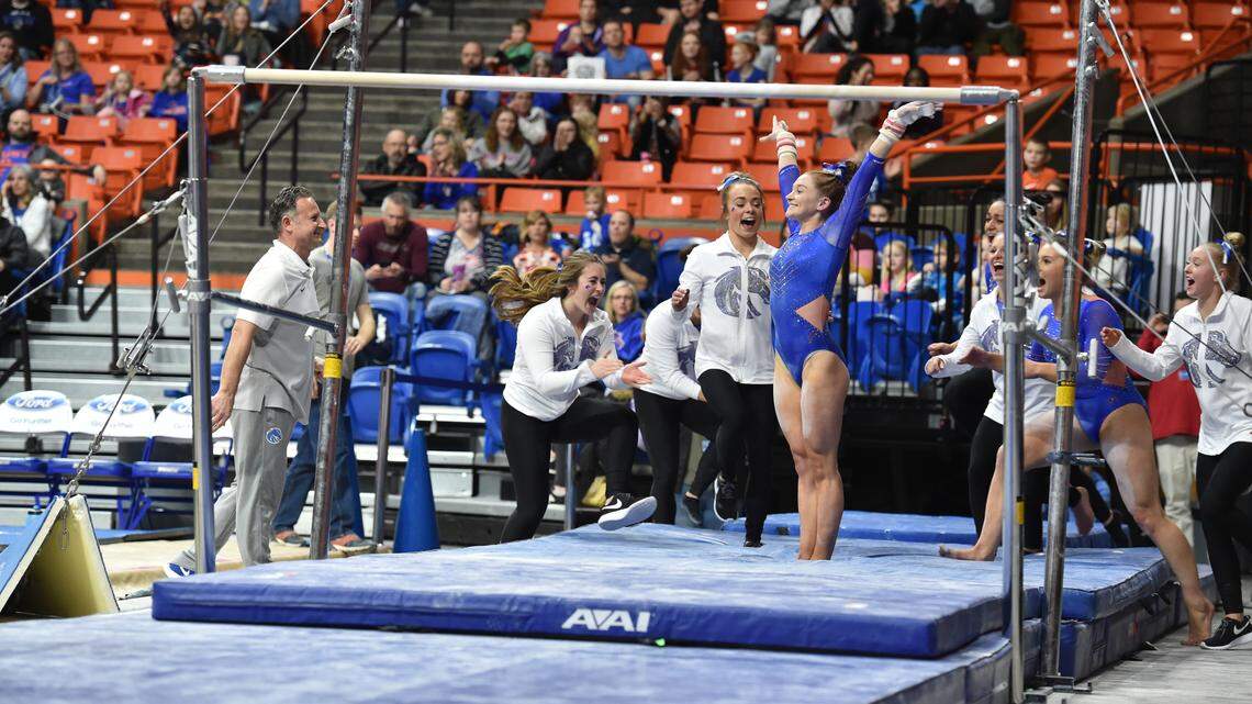 Boise State’s Emily Muhlenhaupt reacts after sticking the landing during a bars routine last season.