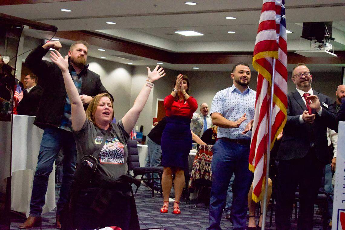 Republican supporters react to NewsMax calling the election for Donald Trump at the Republican election night party at The Courtyard by Marriott in Meridian.