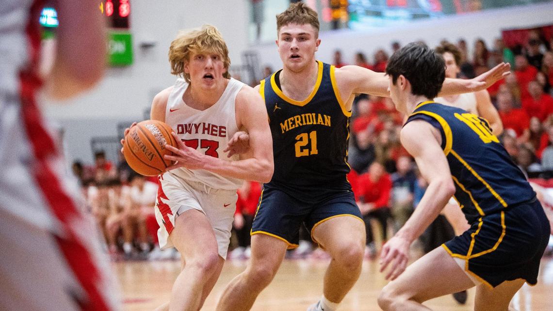 Owyhee junior Liam Campbell, left, scored a game-high 26 points in a 71-48 rout of Owyhee that clinched the Storm a state tournament berth.