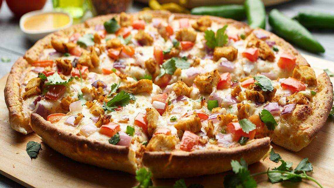 Pizza Twist says “you can’t go wrong” with its butter chicken pizza.