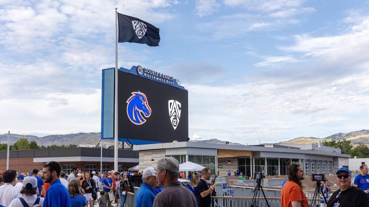 A Pac-12 flag is raised during the Boise State Pac-12 Launch Party event at Albertsons Stadium, Tuesday, June 30, 2026. Boise State Athletics officially moved to the revived Pac-12 Conference on July 1. The move ends a 15-year tenure in the Mountain West Conference for Boise State.