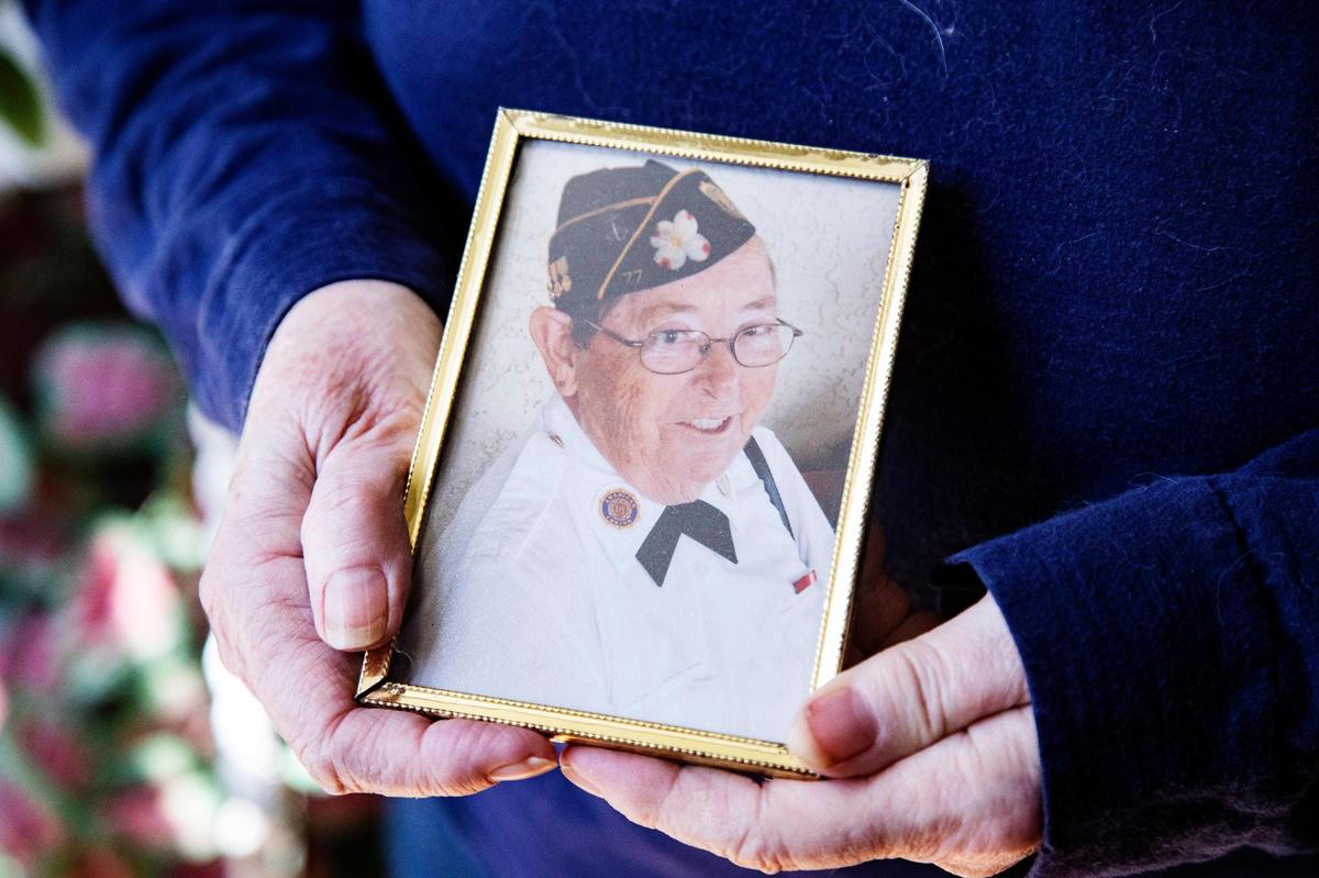 Karen Hicks, sister of the late Idaho Navy veteran Madelynn “Lee” Taylor, holds a photograph of Taylor at Hicks’ Nampa home on Tuesday.