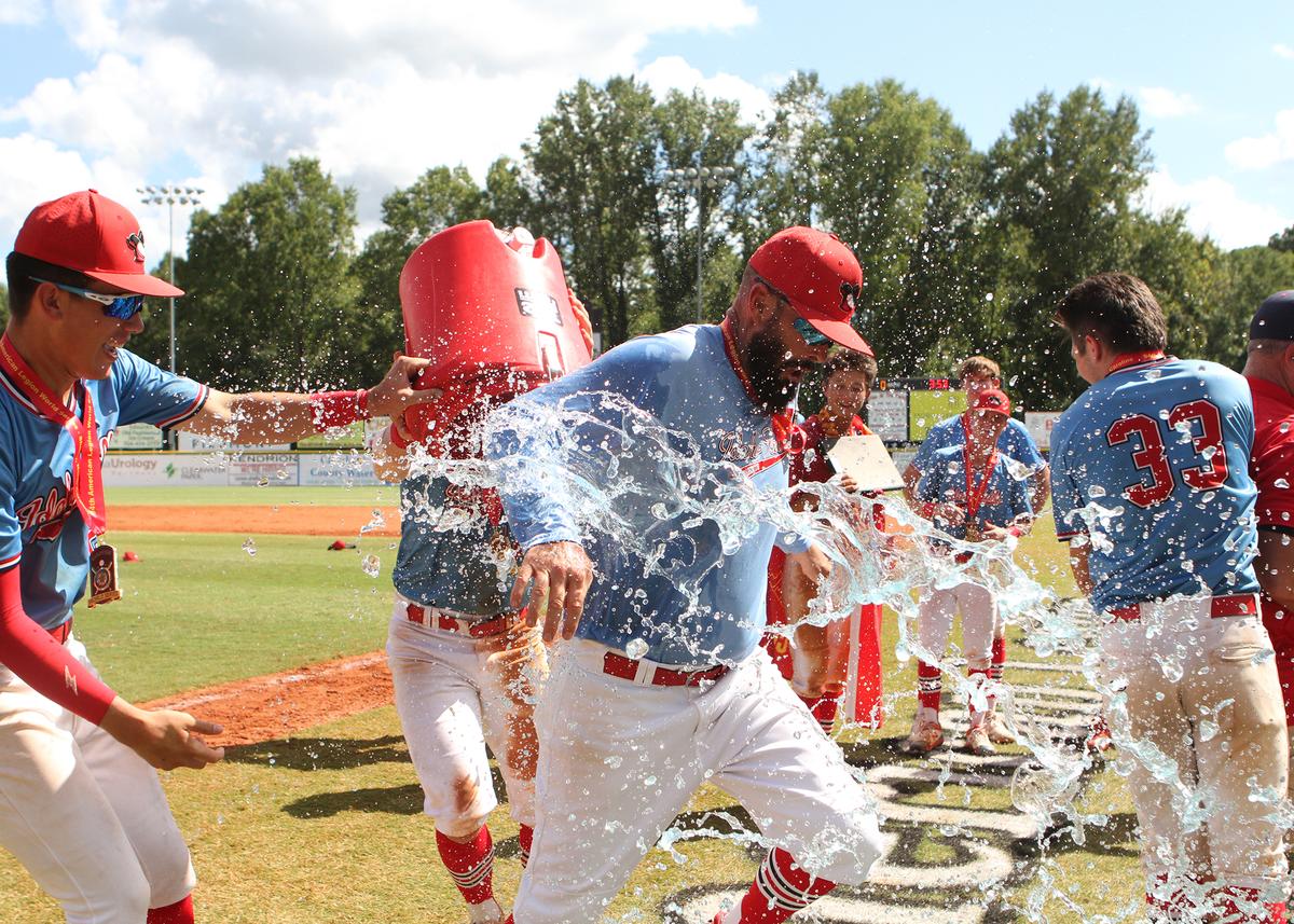 Idaho Falls Bandits coach receives a celebratory dousing after the Bandits repeated as American Legion World Series champions with a 6-1 win over Hawaii’s Team Central on Wednesday in Shelby, North Carolina.