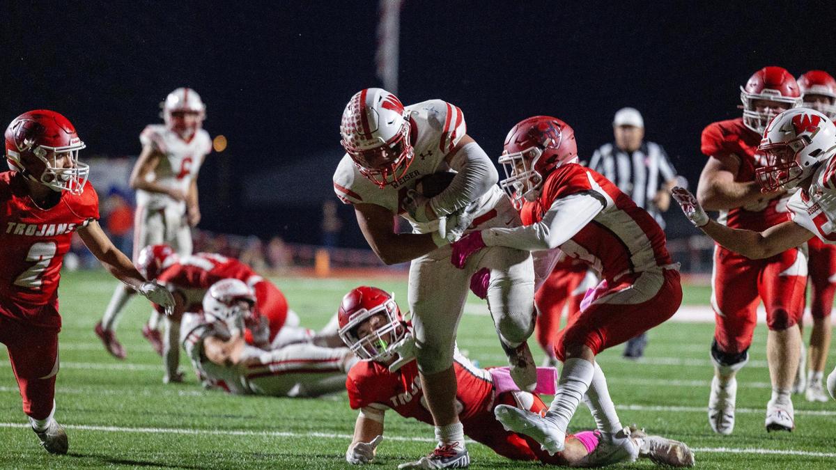 Weiser running back Kaleb Grove fights for extra yards against Homedale on Oct. 6.