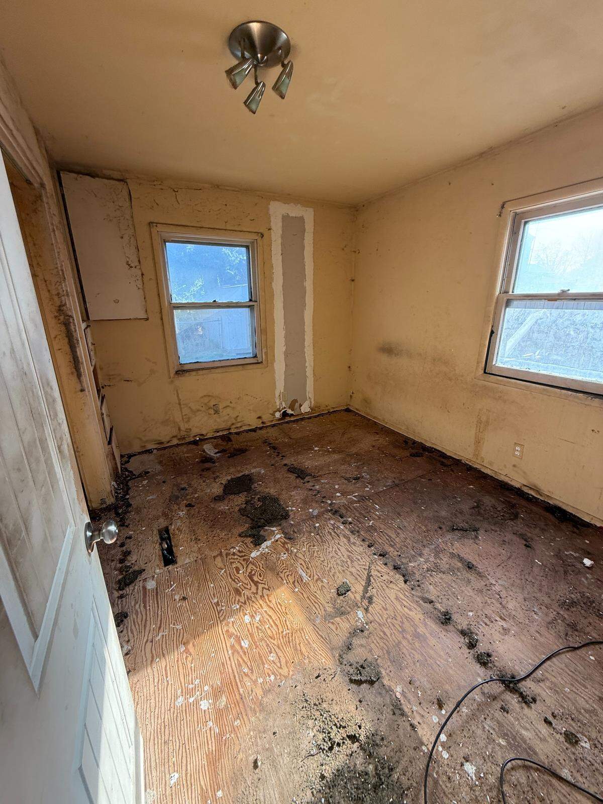 The bedroom of the Boise home was stripped before renovations.