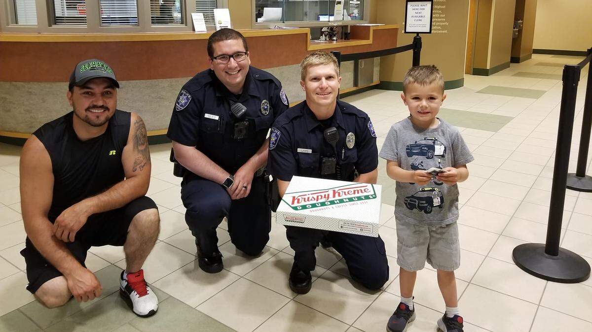 On July 1, 2018, Nedim Cavcic, far left, helped comfort Meridian Police Officer Kyle Mikowski, third from left, after Mikowski was shot in a confrontation with a state parole fugitive. The pair first met one month earlier when Cavcic and his son, Eldin, brought a box of doughnuts to the Meridian Police Department as a surprise for the officers. This photo was taken that day. "Officer Mikowski and (Officer Trevor Weitzel) came out and just made Eldin's day," Cavcic wrote in a Facebook post. "They joked around with him, gave him stickers and his own badge."