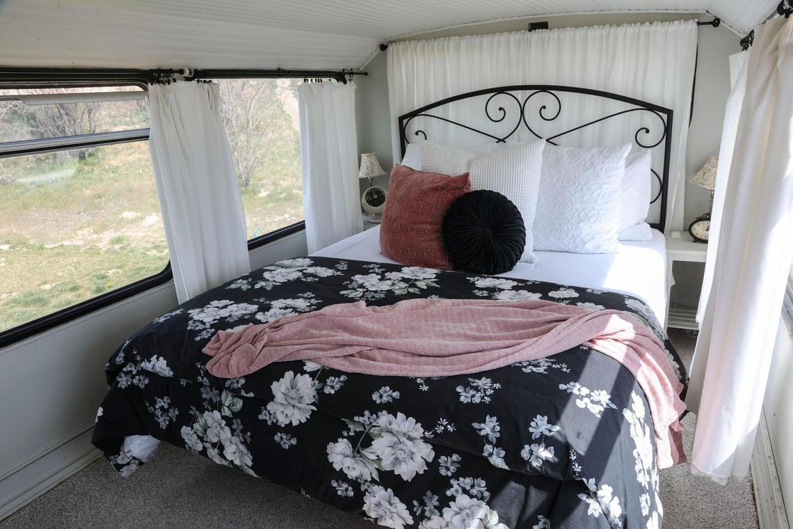A queen bed fits comfortably in the upper-deck bedroom.