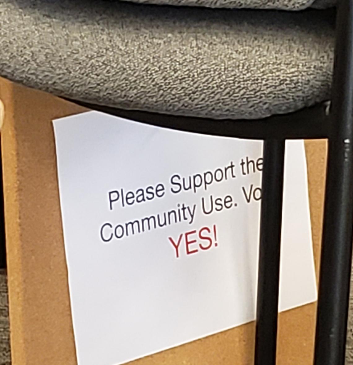 A sign brought by Hannah Ball to the Garden City Planning and Zoning Commission meeting Wednesday asked commissioners to approve her request to operate a weekly farmers market.