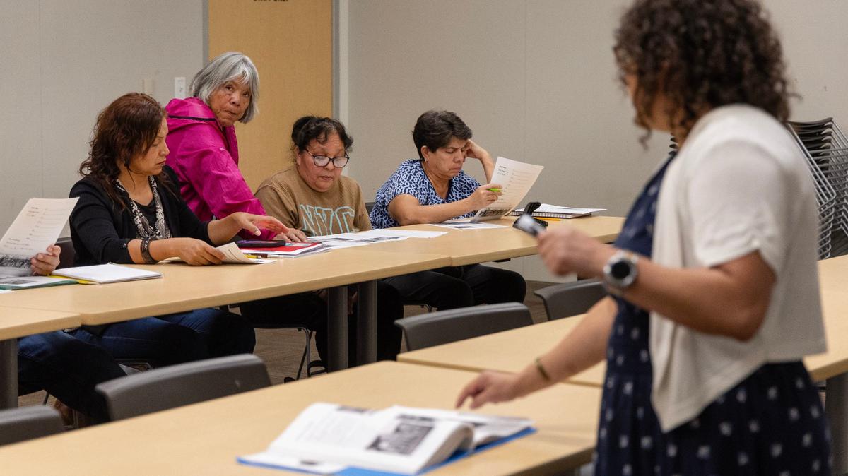 Instructor Elestina Huddleston gives a lesson to people participating in a free citizenship preparation course at the Nampa Public Library in early October. It’s part of outreach done by the Idaho Democratic Party.
