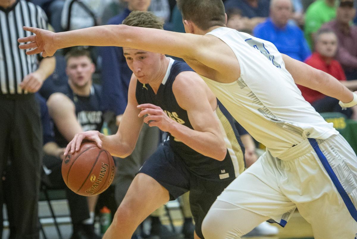 Middleton senior forward Tyler Robinett, left, is the early favorite for boys basketball player of the year in the 4A Southern Idaho Conference.