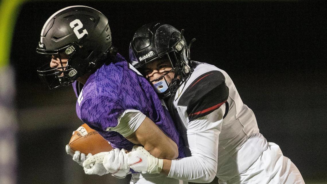 Rocky Mountain wide receiver Hunter Steacker is brought down by Highland cornerback Jaxon Sibounma in the second half of their 5A state quarterfinal Friday in Meridian. Highland won 22-21.