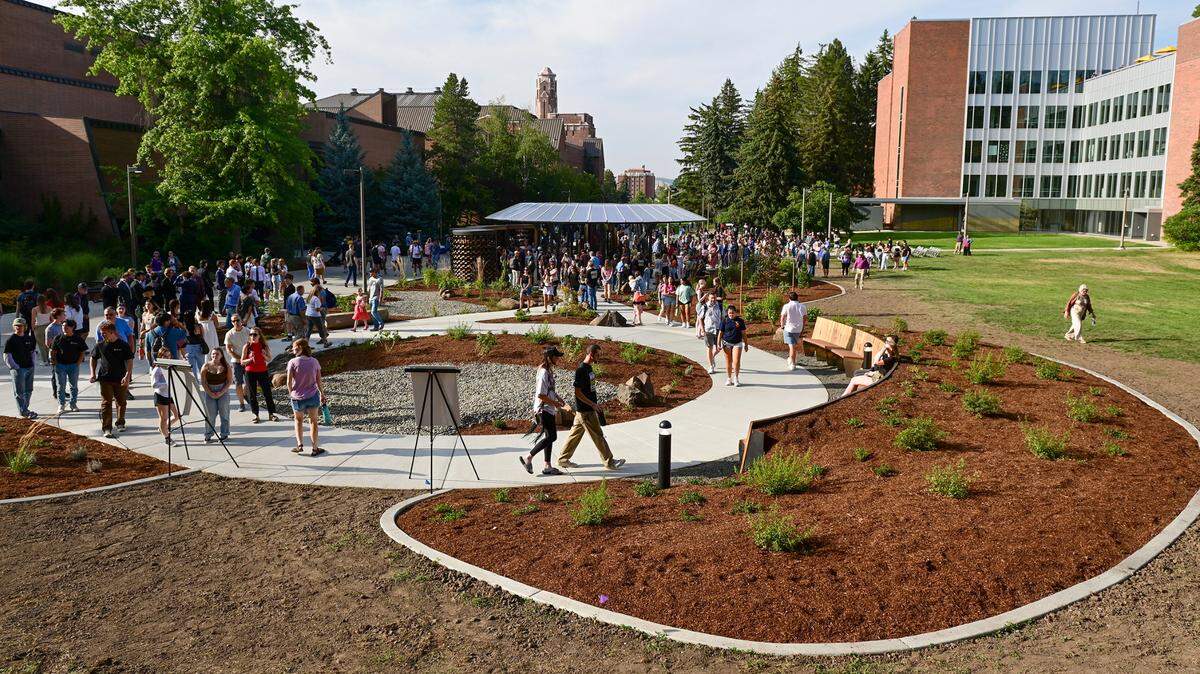 Visitors walk through the Vandal Healing Garden and Memorial after a dedication ceremony on Wednesday in Moscow.