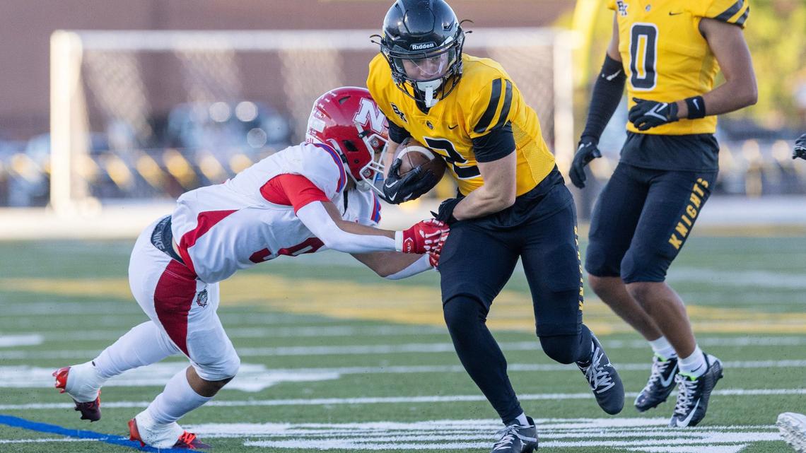 Bishop Kelly wide receiver Boston Huskey carries the ball in the first half of the Knights’ 19-0 win over Nampa on Friday in Boise.