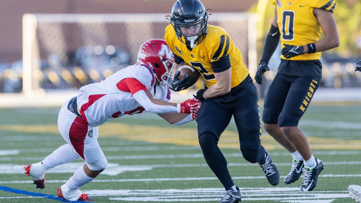 Bishop Kelly wide receiver Boston Huskey carries the ball in the first half of the Knights’ 19-0 win over Nampa on Friday in Boise.