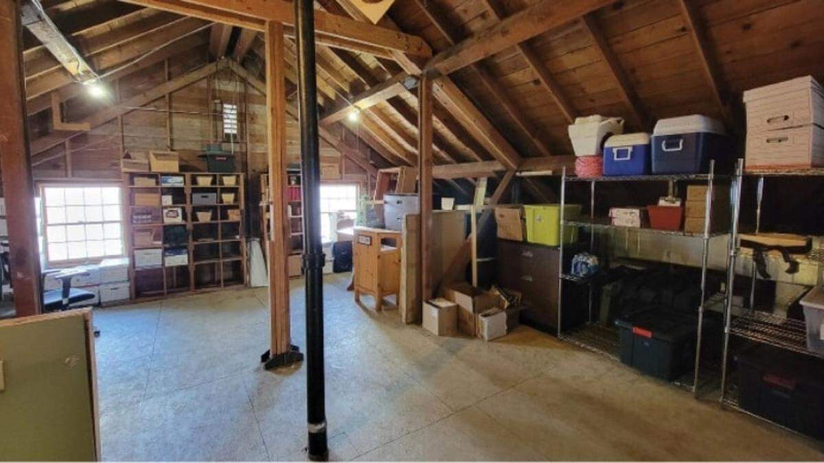 Plans call for replacing the building attic, shown here, with a reading loft.