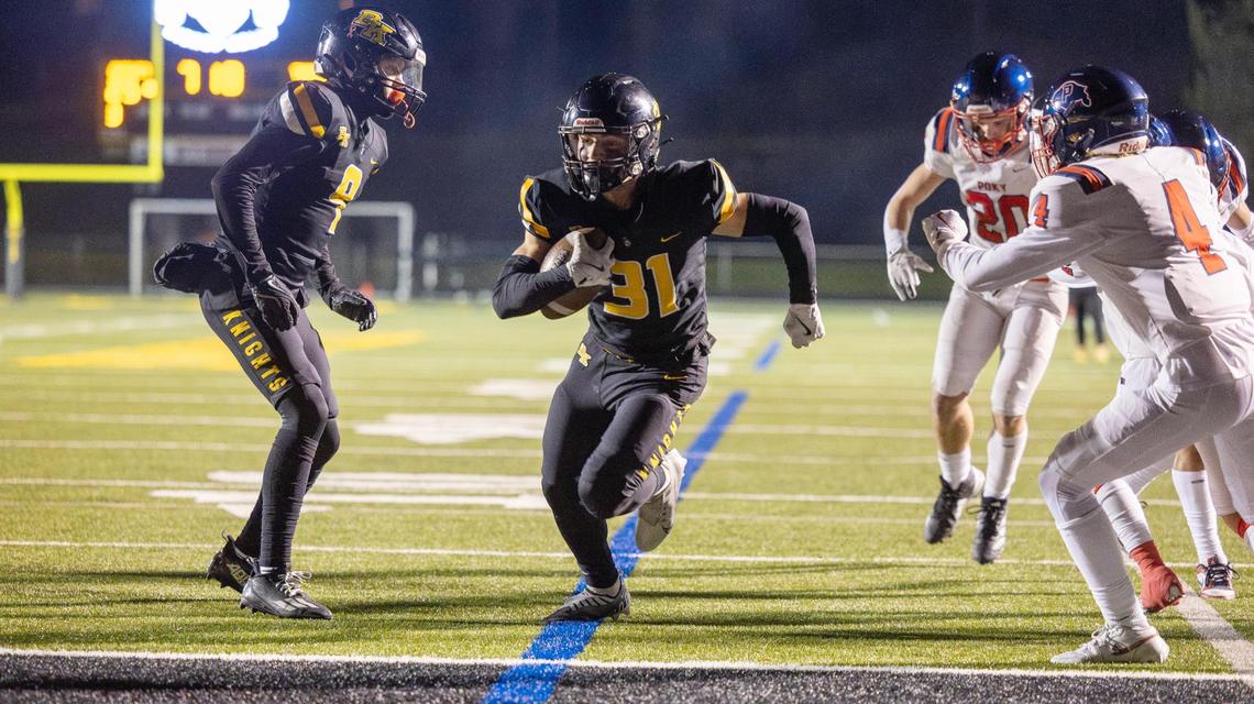 Bishop Kelly kicker Nik Ciovacco scores a two-point conversion on a trick play Friday against Pocatello.