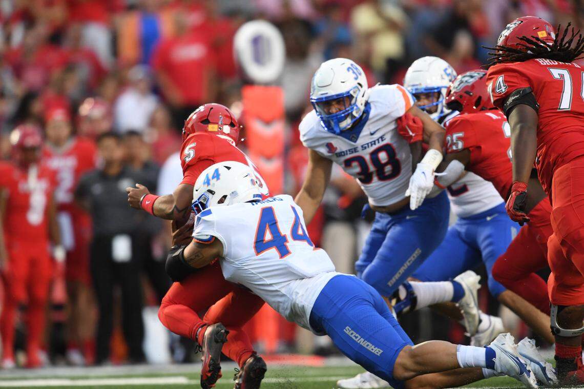 George Tarlas takes down New Mexico QB Miles Kendrick on Friday night for one of his sacks, part of a smothering effort by the defense. The Broncos sacked Kendrick six times and pressured him into a terrible night: 9-of-28 passing for 98 yards.