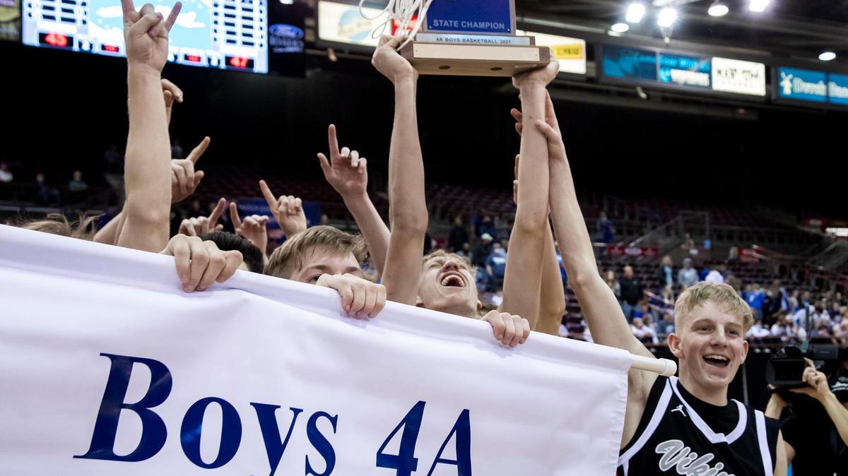 Middleton junior Tyler Medaris screams as he lifts the 4A boys basketball state championship trophy into the air after the Vikings defeated Preston 47-45 for the title Saturday at the Ford Idaho Center in Nampa.