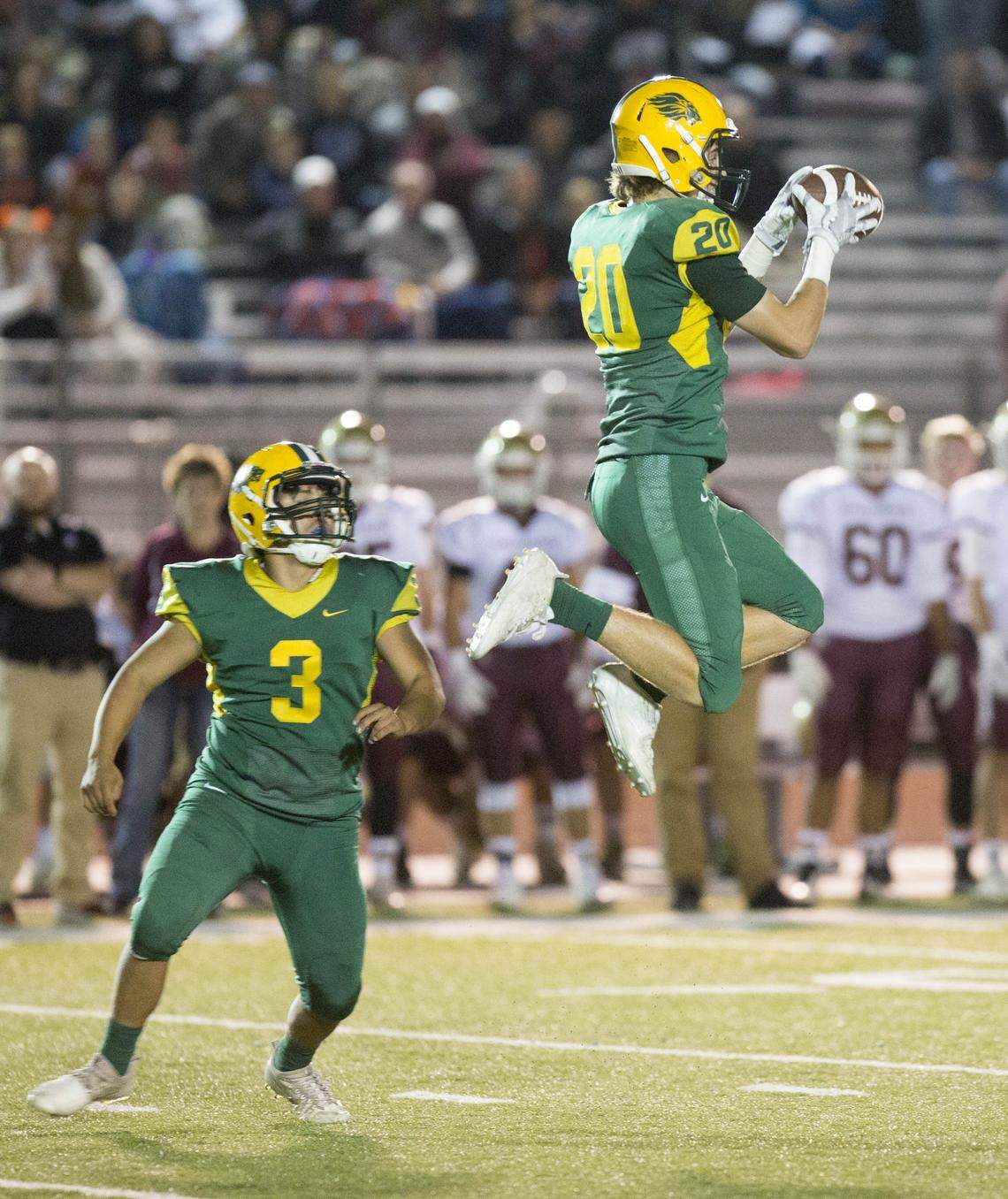 Borah senior Chase Nett leaps to haul in a kickoff last season at Dona Larsen Park. Nett is one of five three-year starters for the Lions this season.