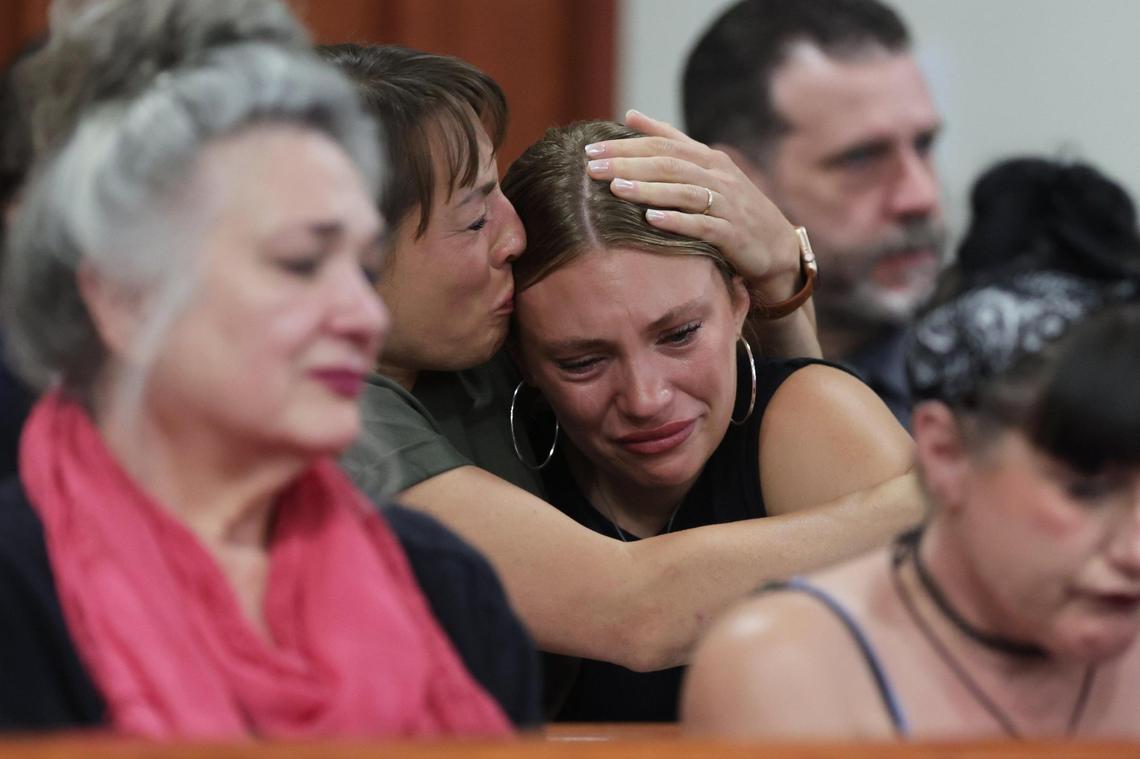 Dylan Mortensen, one of the surviving roommates to the University of Idaho student homicide victims, is comforted by her mother after speaking at the sentencing hearing of Bryan Kohberger.