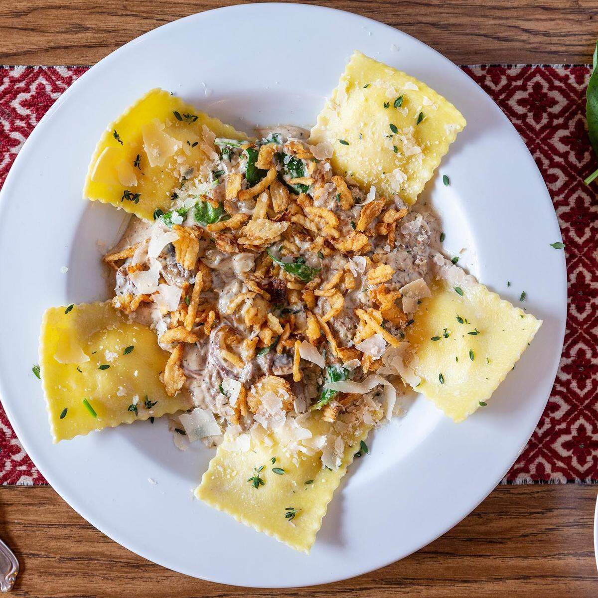 Beef rib ravioli ($19.95): spinach and ricotta ravioli, braised beef short ribs, spinach, mushrooms, grilled onions, beef au jus, cream sauce, fried onions.