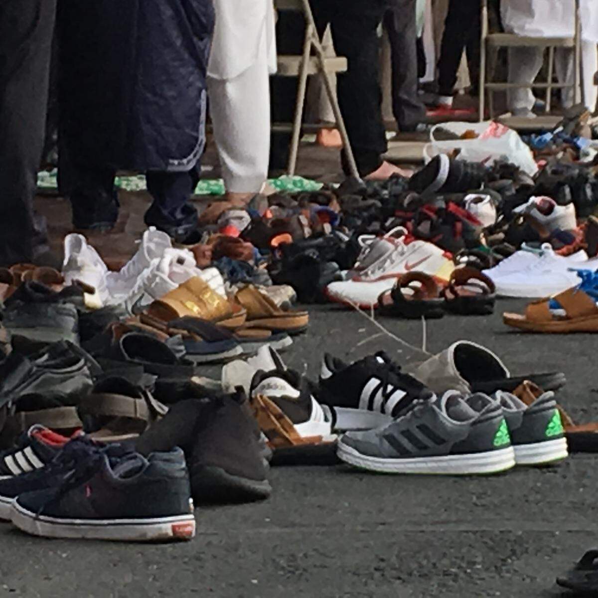 Hundreds of pairs of shoes were removed before prayer Tuesday at the Islamic Center of Boise, as the Muslim community gathered to celebrate Eid al-Adha.