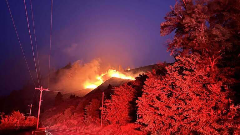 All lanes of State Highway 55 closed north of Banks as wildfire threatens area