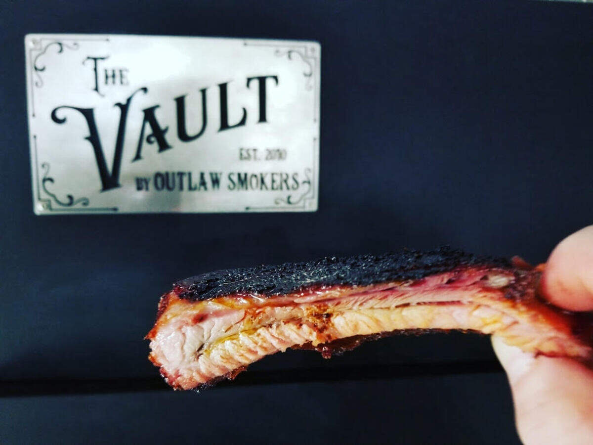 Pork ribs are dry-rub marinated for 48 hours before hitting the smoker.