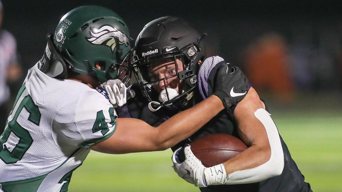 Rocky Mountain running back Jordan Erickson and Eagle linebacker Tyler Ball collide Friday at Rocky Mountain High.
