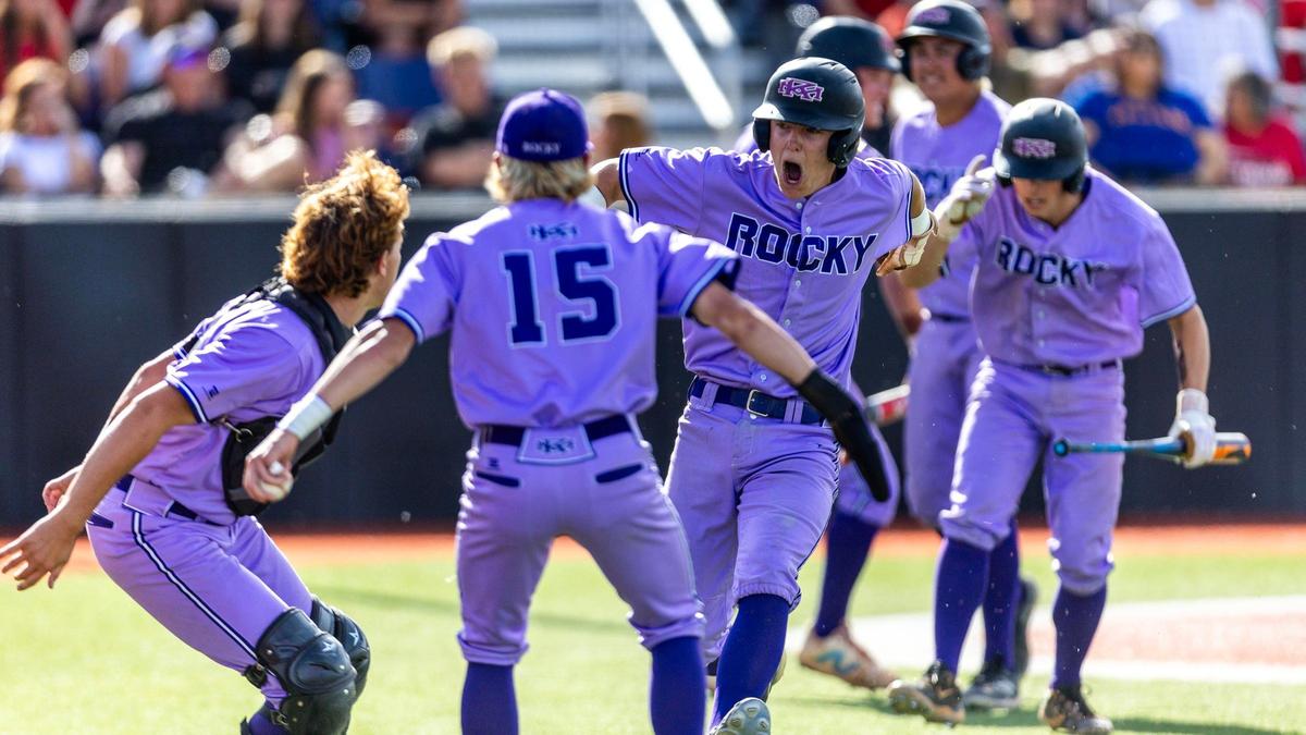 Rocky Mountain’s Aiden Henzler celebrates after scoring a run during the 2024 state championship game. 