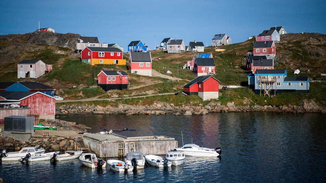 Colorful homes dot the shoreline in Kulusuk, a settlement in the Sermersooq Municipality in southeastern Greenland. U.S. President Donald Trump aims to acquire the Danish territory, citing national defense.