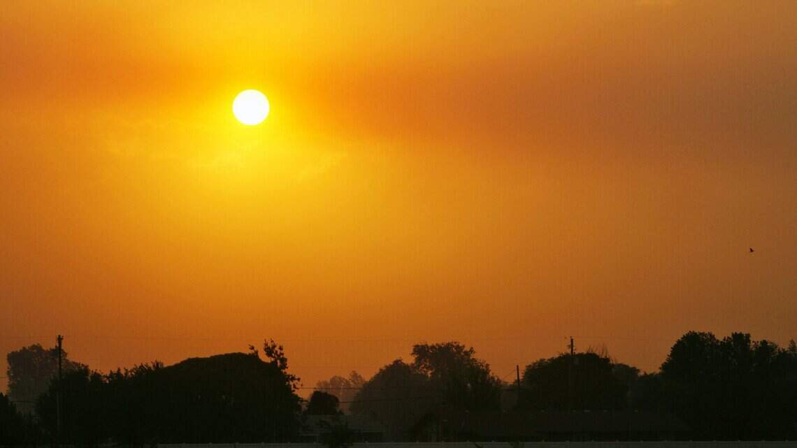 What is it about smoke that makes a sunset more intense?