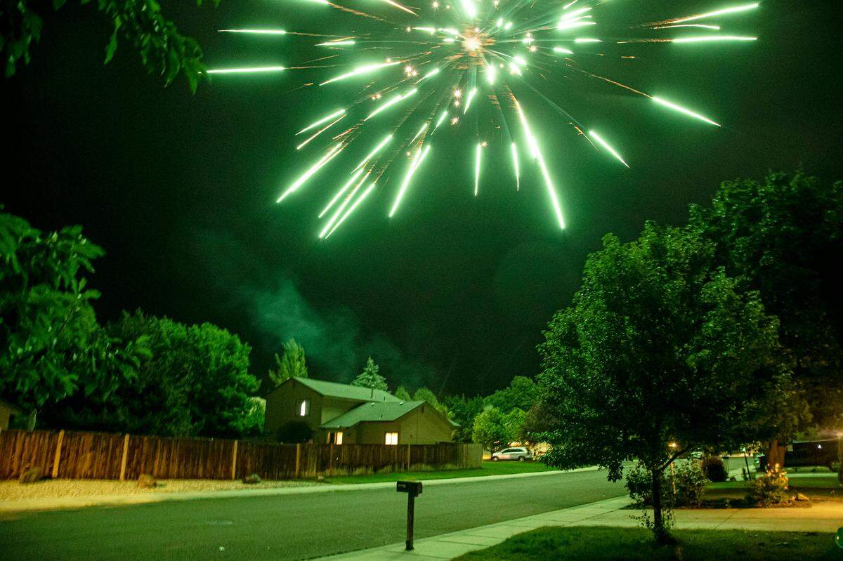 Illegal aerial fireworks are launched above homes in a Northwest Boise neighborhood Sunday July 4, 2021.
