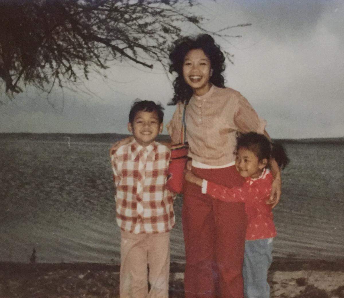 Phouthasinh Louangketh stands with her two children at Lake Lowell in Nampa around 1982, one year after arriving in the United States.