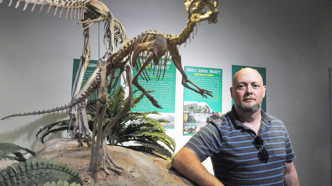 L. J. Krumenacker is shown with a skeleton of Oryctodromeus cubicularis.