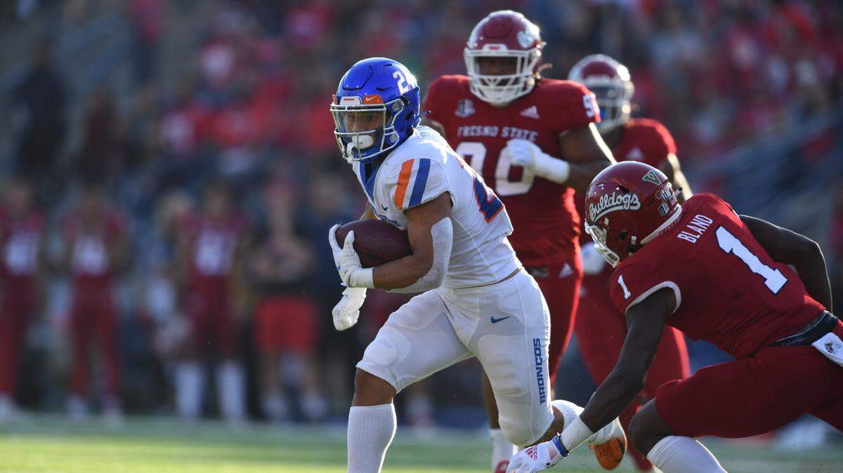 Boise State running back George Holani takes off during the Broncos’ blowout win over Fresno State on Saturday night. Playing in his first full game without limitations this season, Holani posted his first 100-yard rushing game since the 2020 season opener against Utah State.