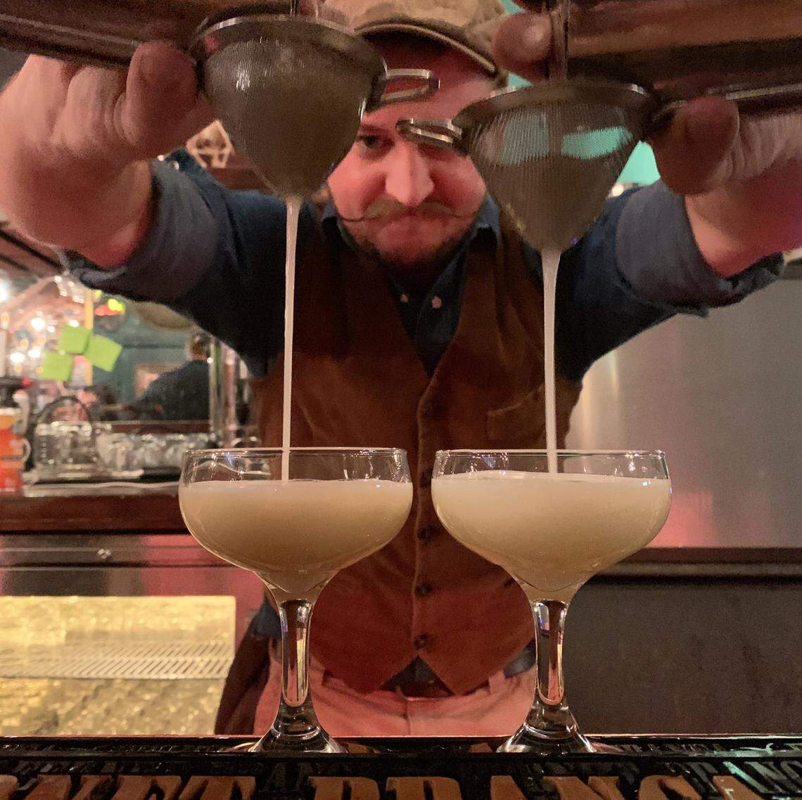 Bar master Erik Schweitzer works mixology magic.