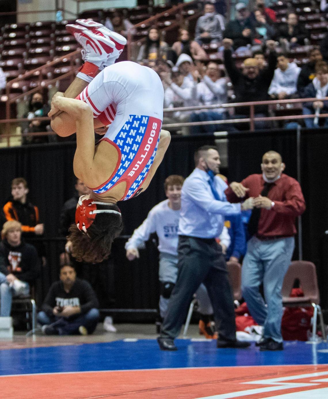 Nampa’s Simon Luna celebrates his state championship last year with a backflip at the Ford Idaho Center.