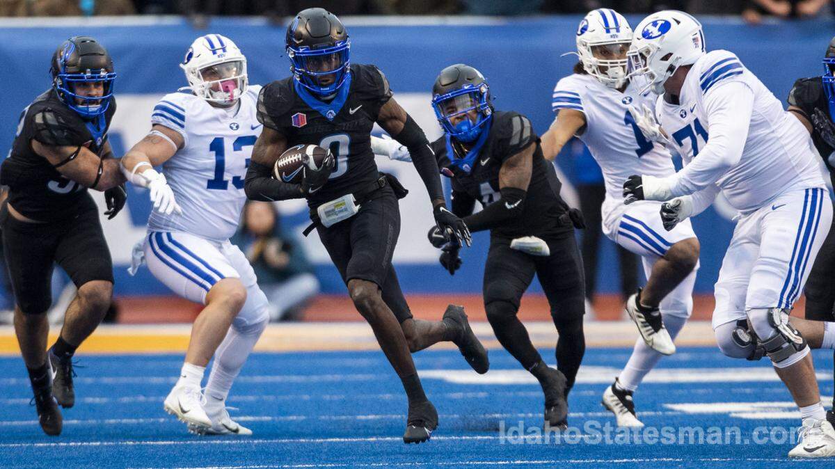 Boise State safety JL Skinner returns an interception of BYU quarterback Jaren Hall in the second quarter Nov. 5 at Albertsons Stadium.