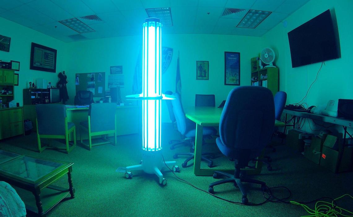 A machine emitting ultraviolet light sanitizes Elmore County Sheriff Mike Hollinshead’s office in early December. The office and jail buildings use the device.