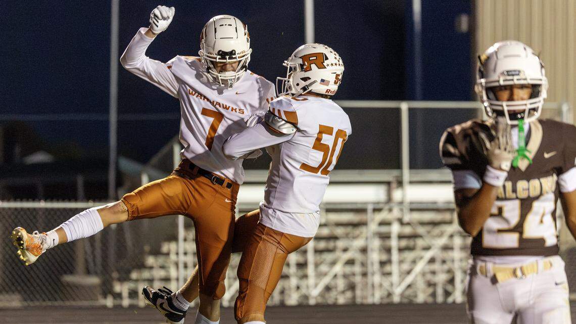 Ridgevue senior running back Isaac Jones, left, celebrates his second quarter touchdown with teammate senior lineman Trace Farrell during their game against Vallivue at Vallivue High School in Caldwell, Friday, October. 3, 2025.